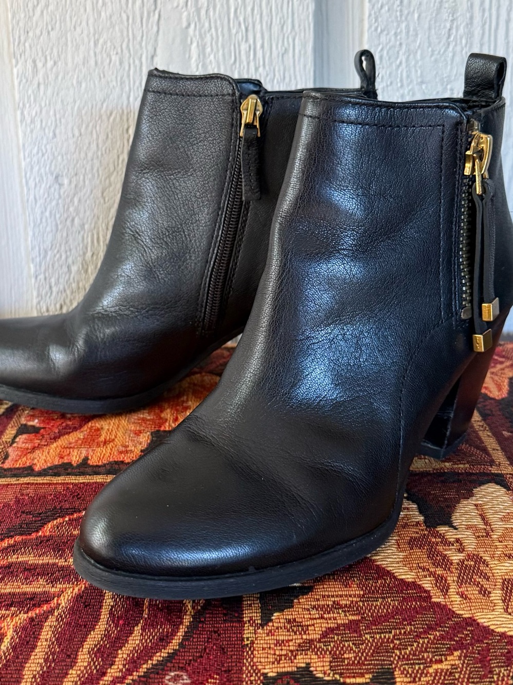 Franco Sarto Black Leather Side-Zip Ankle Booties with Gold Accents
